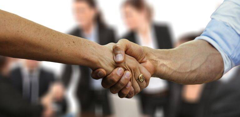 Shaking hands at a business meeting